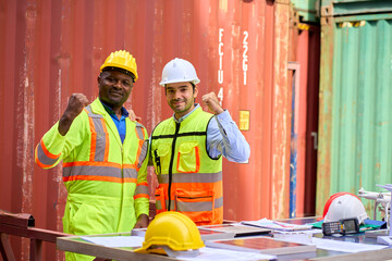 American african foreman and engineer post to portrait together in container box service