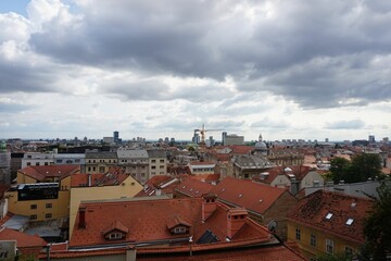 Aerial shot over the red buildings of Zagreb under the cloudy sky, Croatia