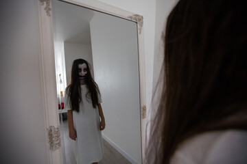 scary girl in white dress from horror film