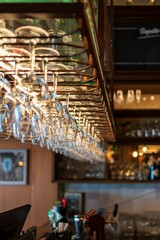 Closeup of hung glasses at the bar