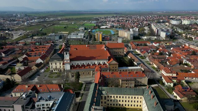 Sunny day in Trnava, aerial footage of St John the Baptist Cathedral, 4k