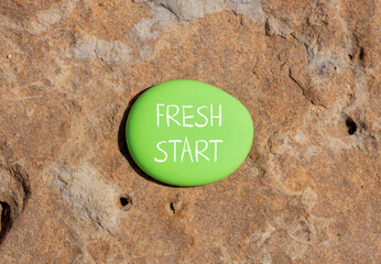 Fresh start and motivational symbol. Concept words Fresh start on beautiful green stone. Beautiful...
