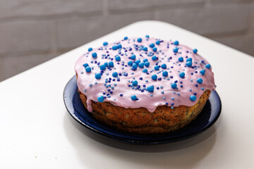 Glazed poppy Easter cake with blue ...