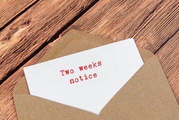 Letter in an envelope with text Two weeks notice