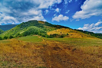 Fototapeta premium Scenic view of a hill under the beautiful blue sky