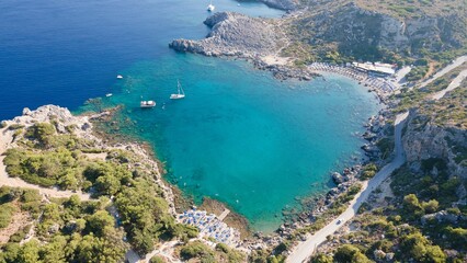 Aerial view of a boat sailing the blue ocean