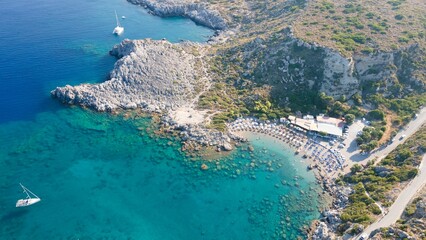 Fototapeta premium Aerial view of a boat sailing the blue ocean