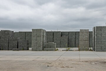 Fototapeta premium Pile of newly produced concrete tiles placed outdoor ready to be picked up and shipped