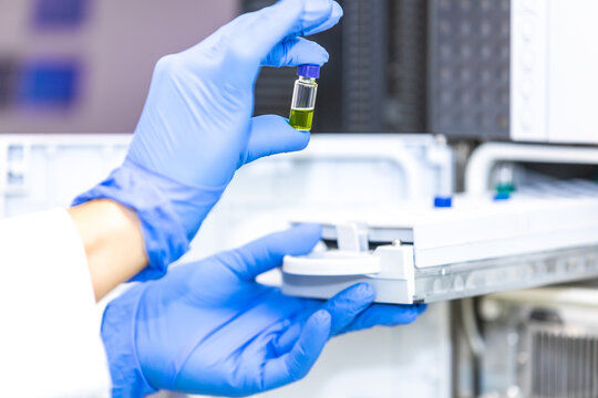 Young scientist or medical technician developing research new pharmacy medicine in glass flask in the clinical laboratory, concept of pharmaceutical studies and researches