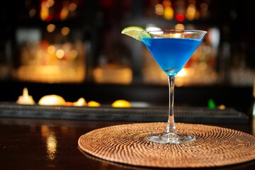 Closeup of a delicious refreshing blue cocktail on a bar counter