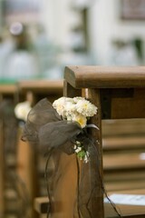 Selective focus of wedding decorative white flowers in a church