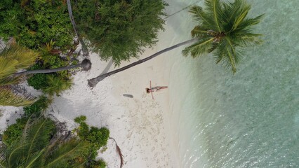 Stranded on an island in Maldives with sand beach and palm trees