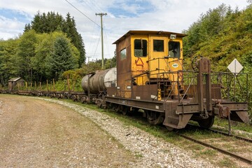 Fototapeta premium Caboose of an old logging railroad train in the woods