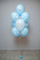 white and blue balloons on the floor