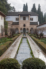 The Patio de la Acequia in the Generalife of Alhambra -- a palace and fortress complex located in Granada, Andalusia, Spain. Islamic Moorish architecture.