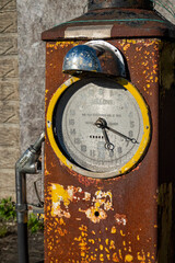 A rusty and disused petrol pump by the side of a minor road in Wiltshire, UK