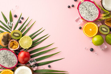 Tropical getaway. A stunning top view flat lay of exotic fruits like dragon fruit, kiwi, orange,...