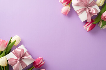 Mother's Day pink present concept. Top view flat lay of pretty pink present boxes with ribbon, tulip flowers on a soft pastel purple background with space for text or advert