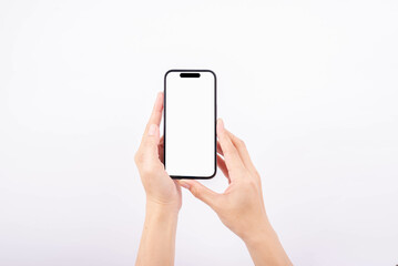 Female hands on a smartphone sideways and a touch screen.