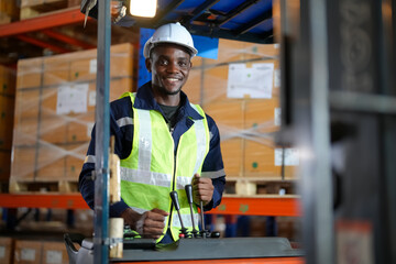 Man forklift driver working in a warehouse.