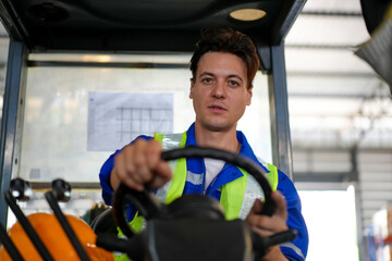 Man forklift driver working in a warehouse.