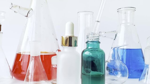 skin serum, moisturizing and whitening serum, fruit acids.Glass Volumetric Flask  ,Laboratory Flasksare used for  laboratory work  in the background