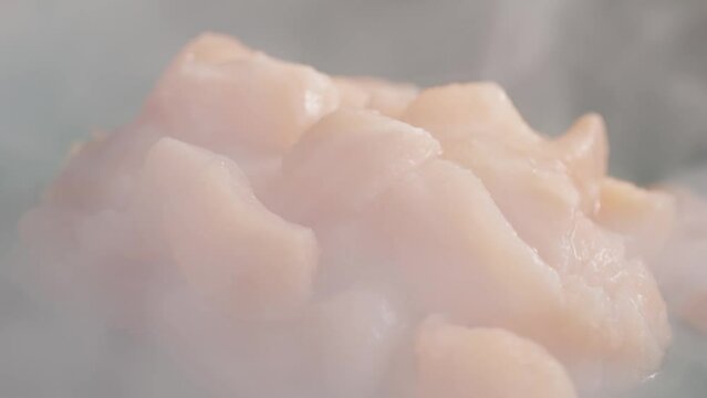 Norwegian smoked salmon seviche with pouring lemon lime and grapefruit juice, onion Healthy diet food, close up