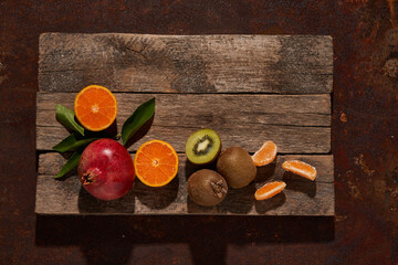 Ripe fruits on wooden surface