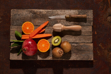 Ripe fruits on wooden surface