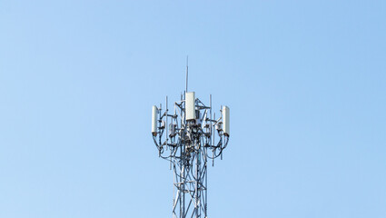Communication tower telephone pole wireless technology signal future. Telecommunication tower of 4G and 5G cellular. Smart antennas mounted on metal against with sunlight cloud sky is background.