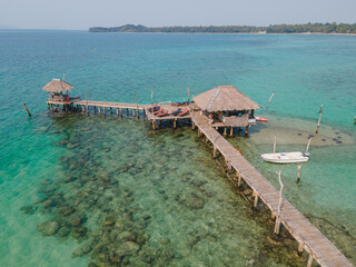 Hidden bungalow in sea, walking from beach by wooden bridge, range of coral and rock for snorkeling 