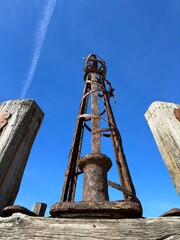 Fototapeta na wymiar Looking up at the iron towers of St Anne's pier in Lytham Lancashire with a blue sky background. 