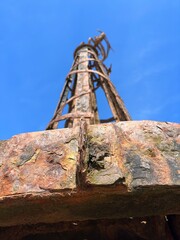 Looking up at the iron towers of St Anne's pier in Lytham Lancashire with a blue sky background. 