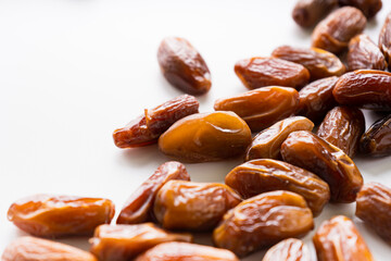 Fresh dried dates fruit on white isolated background. 