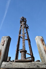 Fototapeta na wymiar Looking up at the iron towers of St Anne's pier in Lytham Lancashire with a blue sky background. 