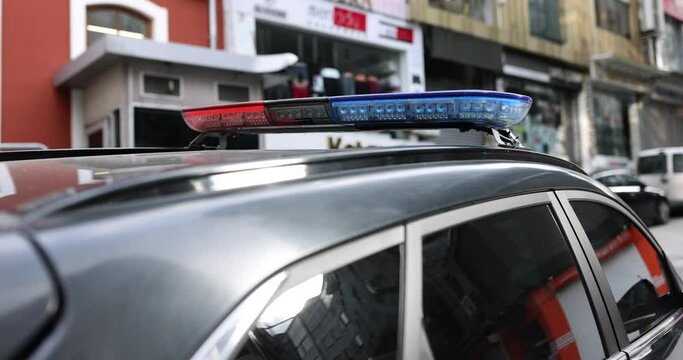 Red blue light on lamp of police car closeup 4k movie slow motion. Emergency help concept