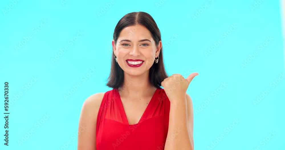 Sticker Woman face, pointing and studio with beauty, happiness and smile showing mockup for advertisement. Portrait, isolated and blue background with a happy young female point to show mock up announcement