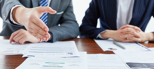 Panoramic of a businessman holding his hand in front in agreement next to a businesswoman