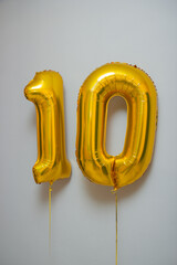 golden balloons number 10 on white background