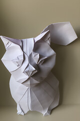 origami of a cute cat on a light background, generative ai