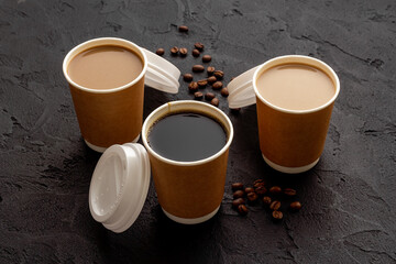 Fototapeta na wymiar Takeaway coffee in paper cups. Coffee to go concept