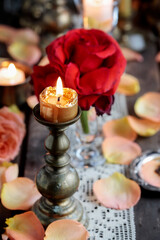 Romantic table decoration with roses and candles. Valentine's Day decorating ideas.