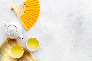 Japanese table setting with teapot and cups of tea