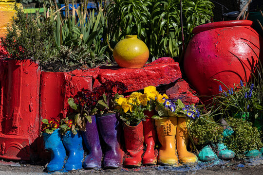Copenhagen, Denmark Colorful rubber boots used as plant pots in the Christiania freetown district.