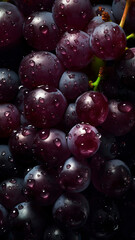 Fresh Grapes background, adorned with glistening droplets of water, top down view.