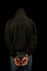 Arrested teenage boy in hoddie and mask