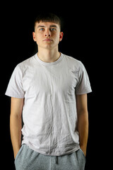 Fototapeta premium A portrait of a teenage male black background