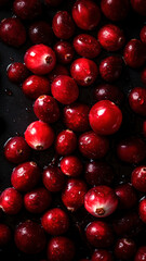 Fresh Cranberries background, adorned with glistening droplets of water, top down view.