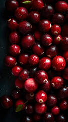 Fresh Cranberries background, adorned with glistening droplets of water, top down view.
