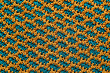 Fototapeta premium Volume knitted background. Seamless yellow green crochet fabric with brick pattern.